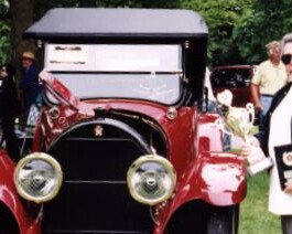 Dick Shappy holding the "Best in Show" trophy at the New England Region Cadillac & LaSalle Club show held at the Newport Abbey in Portsmouth, RI. June 18, 2002.